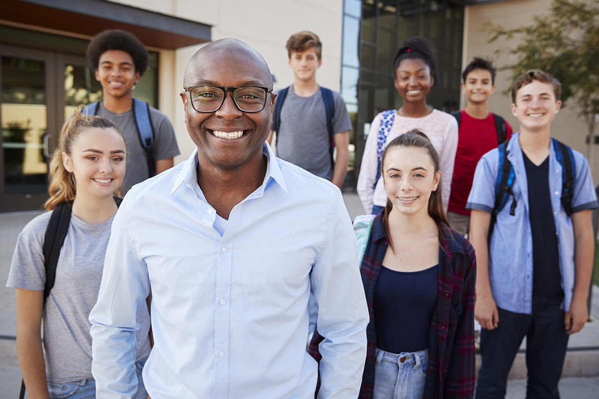 A group of high school students with their teacher