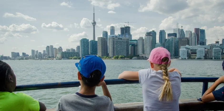 Middle school kids looking at the Toronto skyline from Toronto Island ferry