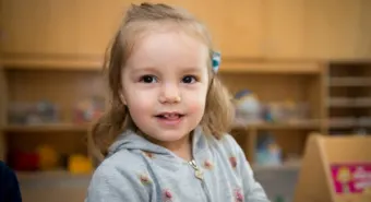 A happy pre-school girl at a YMCA child care centre