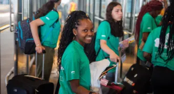 Exchange students on their way with luggage