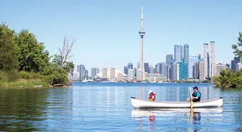 An adult and child on a canoe