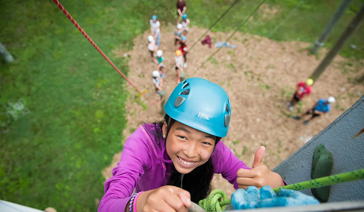 staff and child wearing masks