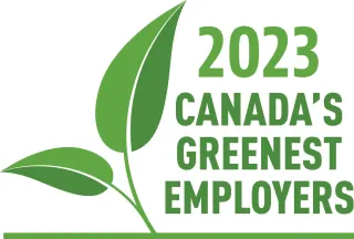 A logo is made up of an illustration of a plant with two green leaves to the left of the words “2023 Canada’s Greenest Employers”