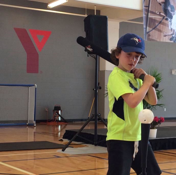 Young boy batters up at Cooper Koo Family YMCA