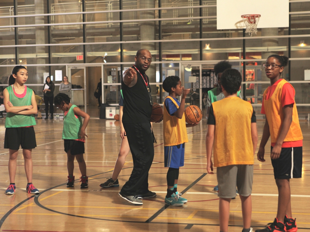 Ed coaches youth at Mississauga YMCA gym