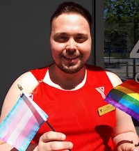 Y team member Joshua with Pride flags