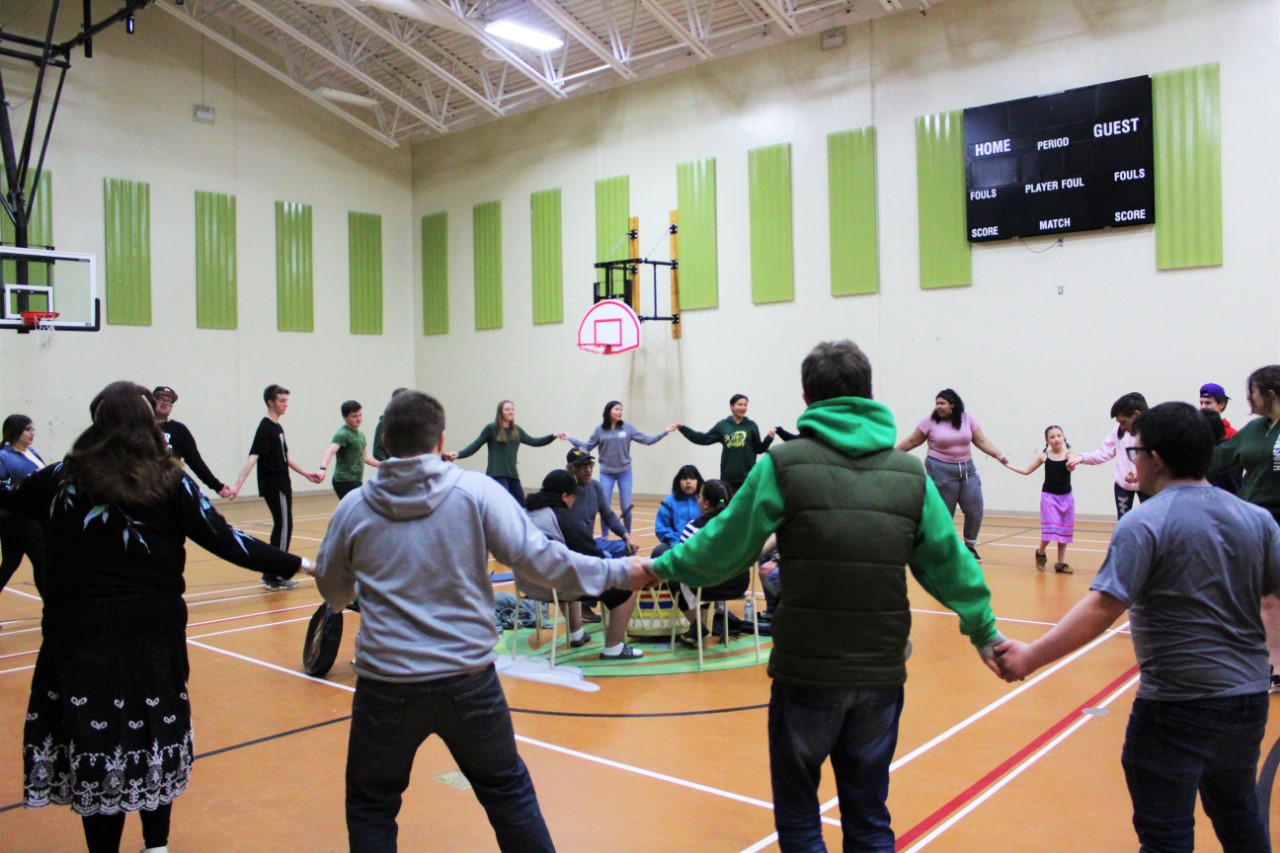 Group of students participating in a drumming circle