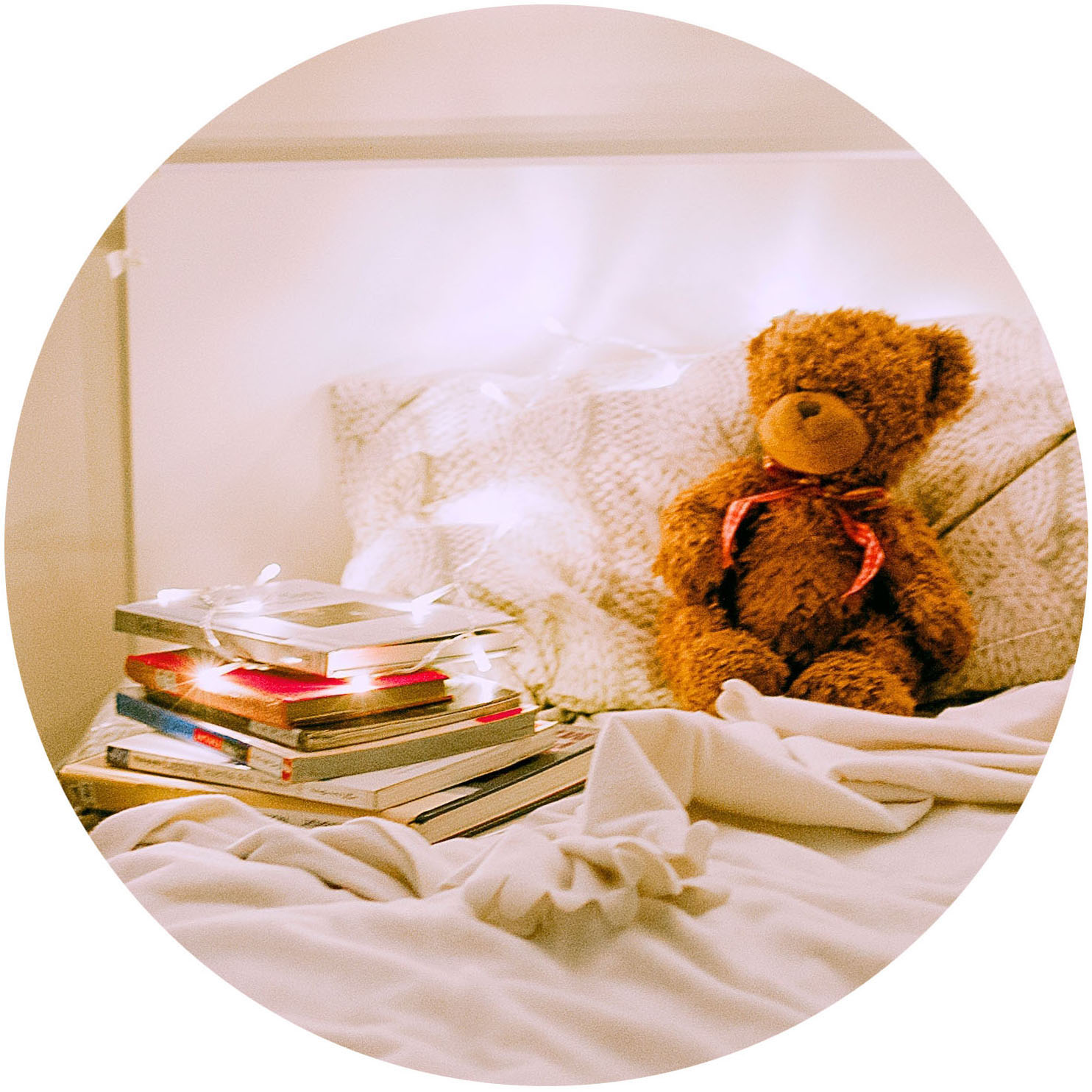 teddy bear sitting in bed