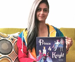 Y staff Sham holds Prince & Knight while sitting on a couch