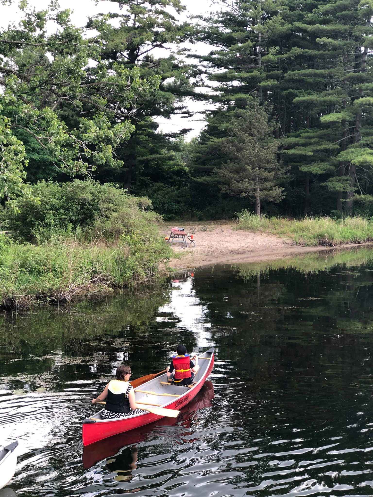 Woman and child in a kayak on the lake