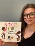jamie holds up a book called pink is for boys