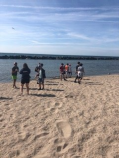 YMCA leadership cleans garbage on a beach